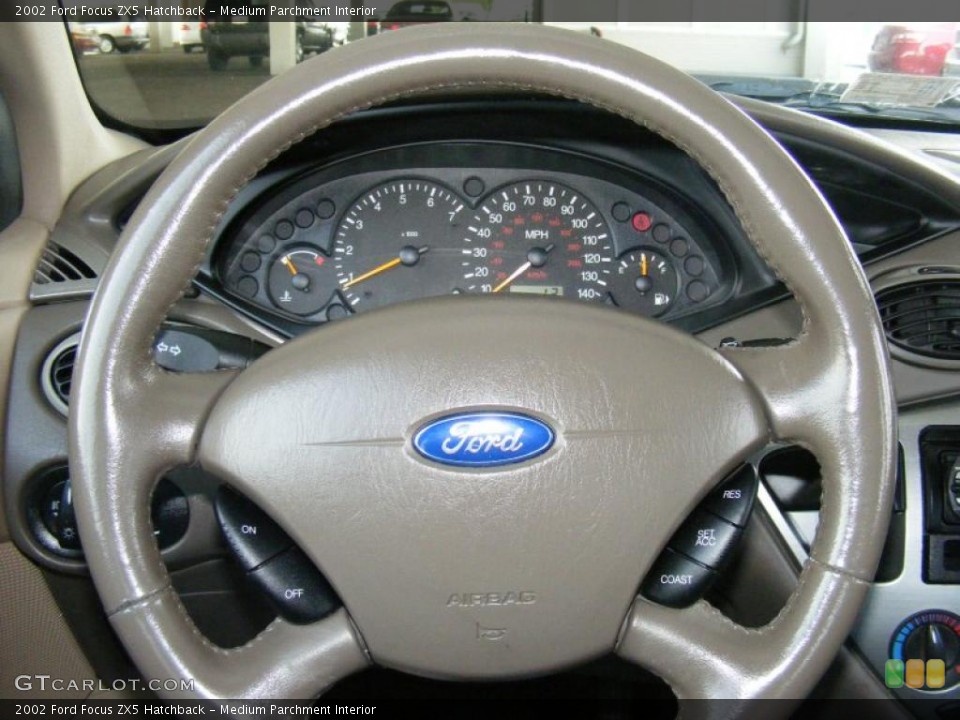 Medium Parchment Interior Steering Wheel for the 2002 Ford Focus ZX5 Hatchback #38402980