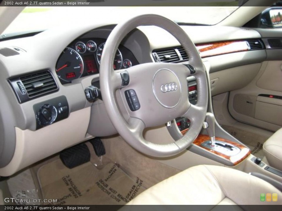 Beige Interior Dashboard for the 2002 Audi A6 2.7T quattro Sedan #38442712