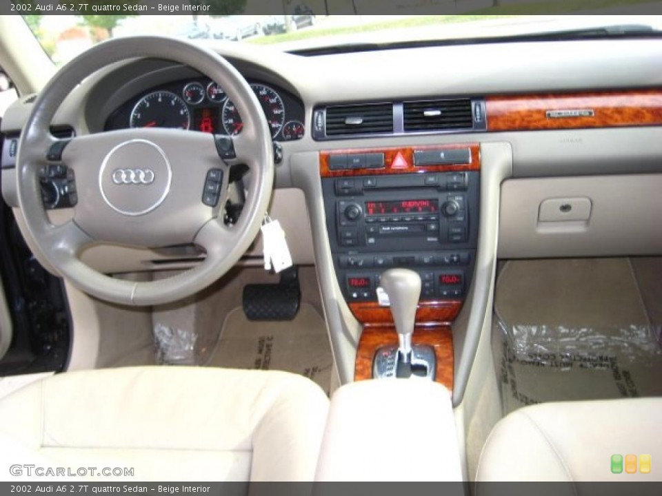 Beige Interior Dashboard for the 2002 Audi A6 2.7T quattro Sedan #38442780