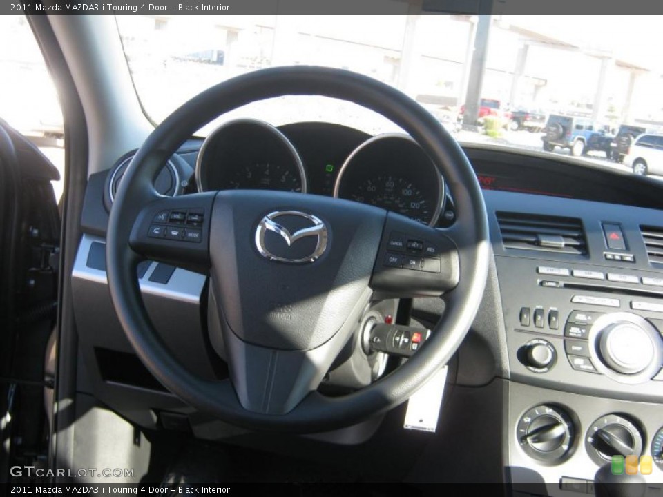 Black Interior Steering Wheel for the 2011 Mazda MAZDA3 i Touring 4 Door #38512199