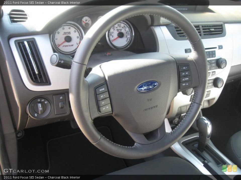 Charcoal Black Interior Steering Wheel for the 2011 Ford Focus SES Sedan #38512675