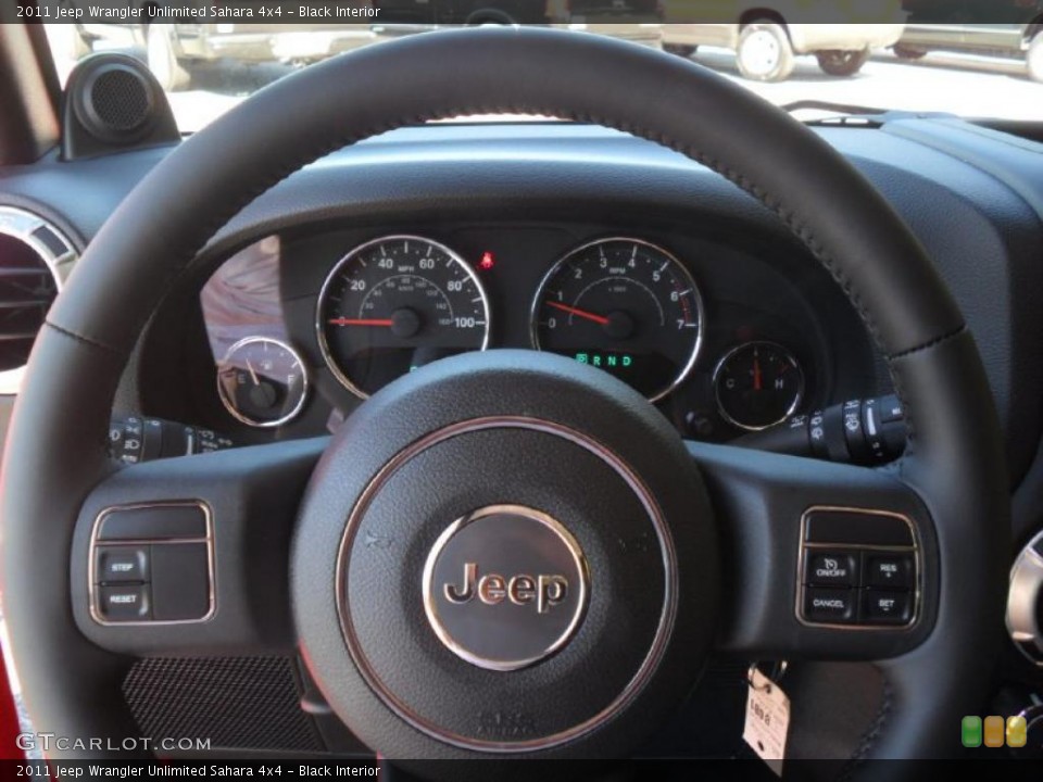 Black Interior Steering Wheel for the 2011 Jeep Wrangler Unlimited Sahara 4x4 #38561333