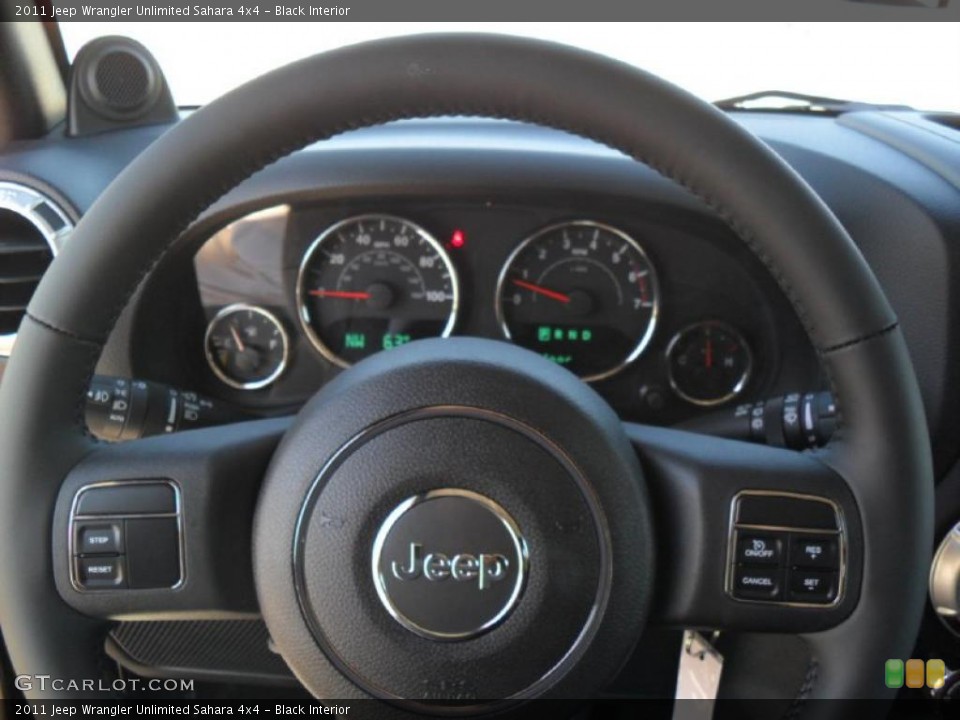 Black Interior Steering Wheel for the 2011 Jeep Wrangler Unlimited Sahara 4x4 #38587601