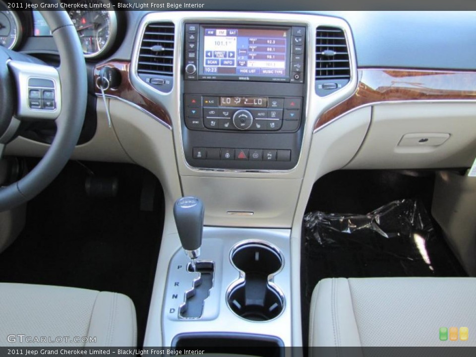 Black/Light Frost Beige Interior Controls for the 2011 Jeep Grand Cherokee Limited #38601561