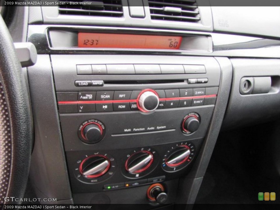 Black Interior Controls for the 2009 Mazda MAZDA3 i Sport Sedan #38646790