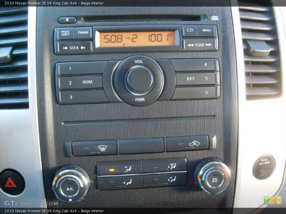 Beige Interior Controls for the 2010 Nissan Frontier SE V6 King Cab 4x4 #38647734