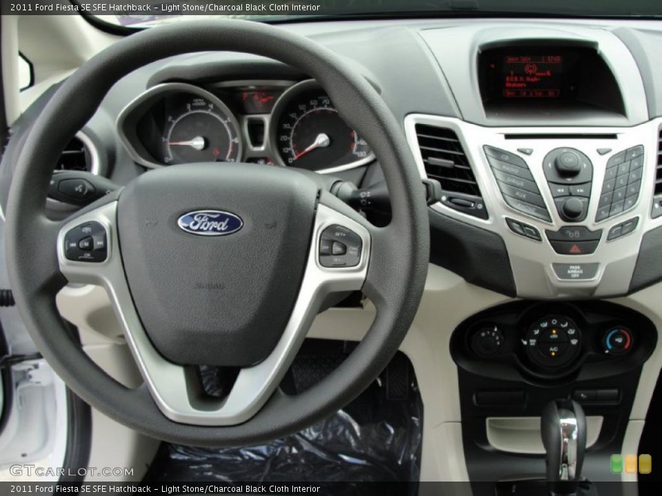 Light Stone/Charcoal Black Cloth Interior Photo for the 2011 Ford Fiesta SE SFE Hatchback #38751556