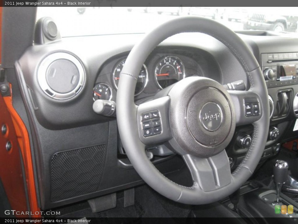 Black Interior Steering Wheel for the 2011 Jeep Wrangler Sahara 4x4 #38789431