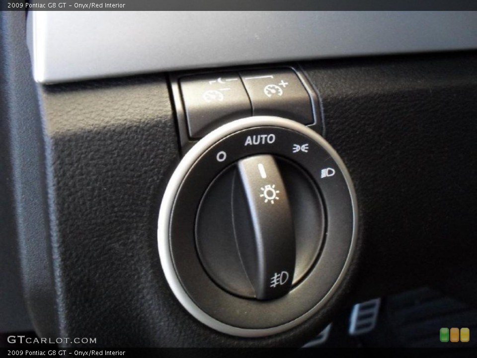 Onyx/Red Interior Controls for the 2009 Pontiac G8 GT #38928738