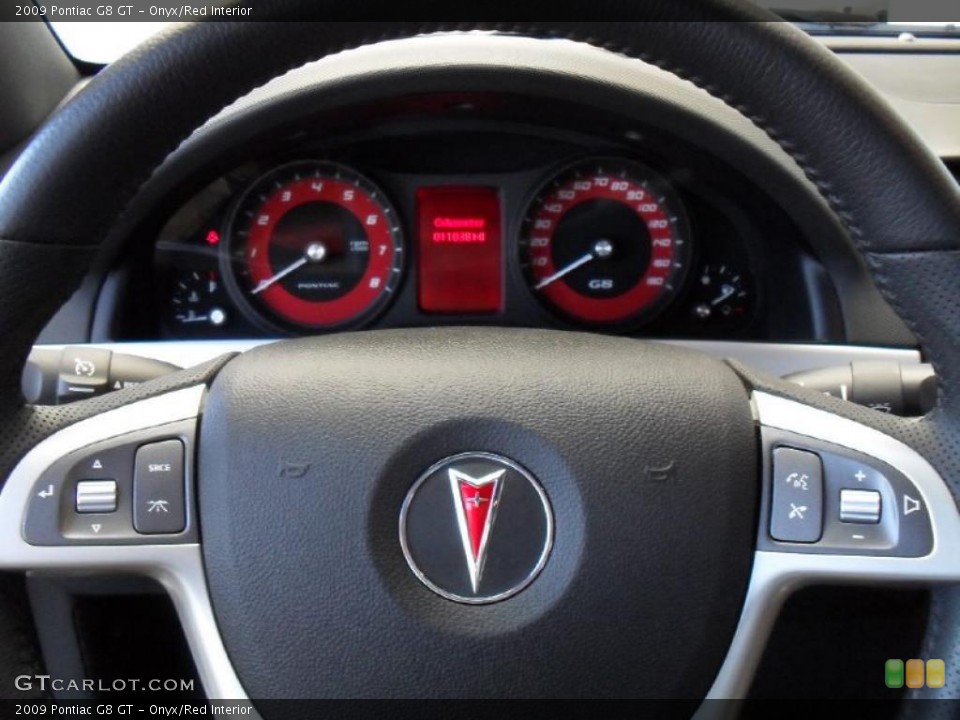 Onyx/Red Interior Controls for the 2009 Pontiac G8 GT #38928774