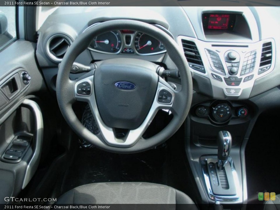 Charcoal Black/Blue Cloth Interior Dashboard for the 2011 Ford Fiesta SE Sedan #38935914