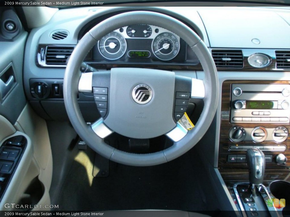 Medium Light Stone Interior Steering Wheel for the 2009 Mercury Sable Sedan #38939162