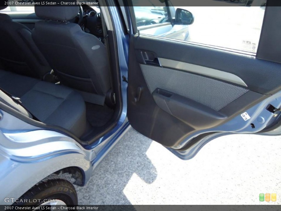 Charcoal Black Interior Door Panel for the 2007 Chevrolet Aveo LS Sedan #38953750