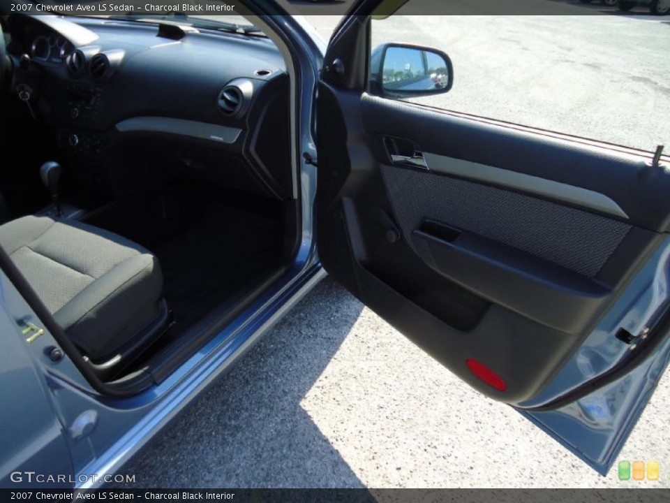 Charcoal Black Interior Door Panel for the 2007 Chevrolet Aveo LS Sedan #38953810
