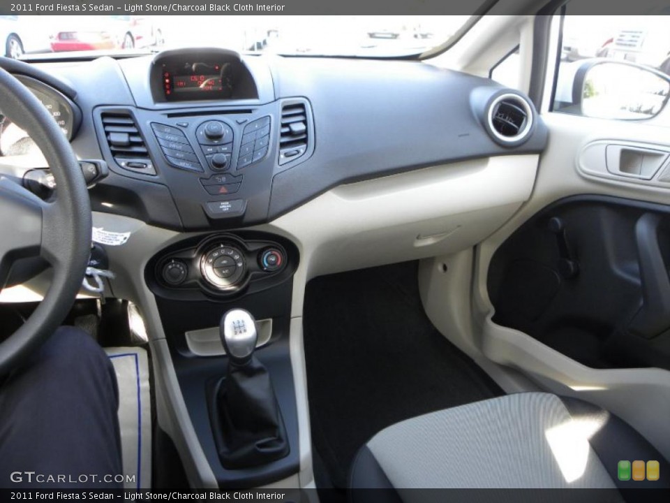 Light Stone/Charcoal Black Cloth Interior Dashboard for the 2011 Ford Fiesta S Sedan #39021303