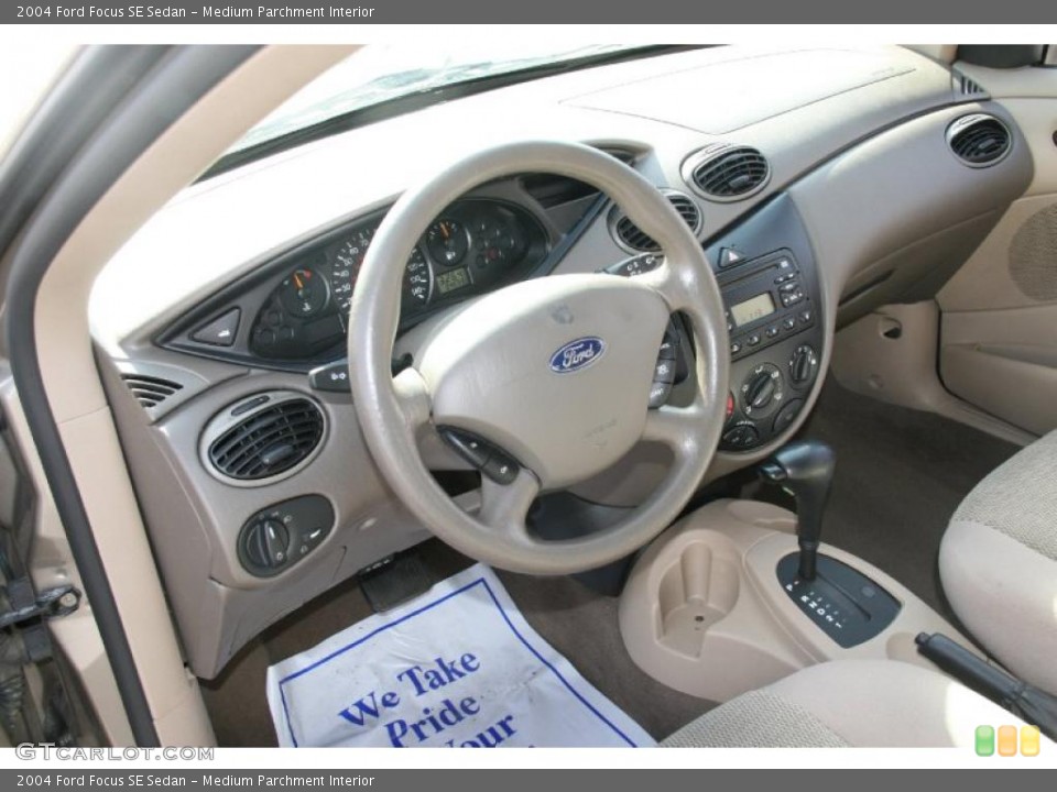 Medium Parchment Interior Dashboard for the 2004 Ford Focus SE Sedan #39044856