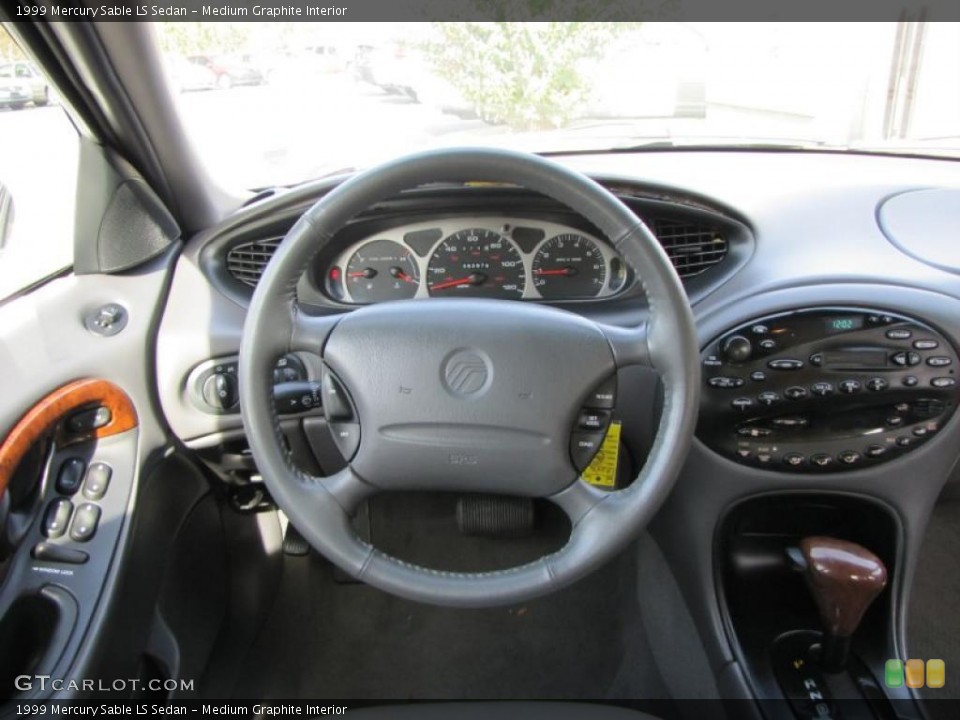 Medium Graphite Interior Steering Wheel for the 1999 Mercury Sable LS Sedan #39074319