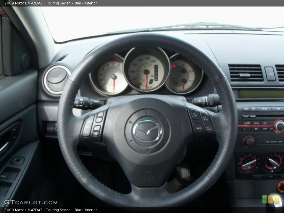 Black Interior Dashboard for the 2009 Mazda MAZDA3 i Touring Sedan #39098622