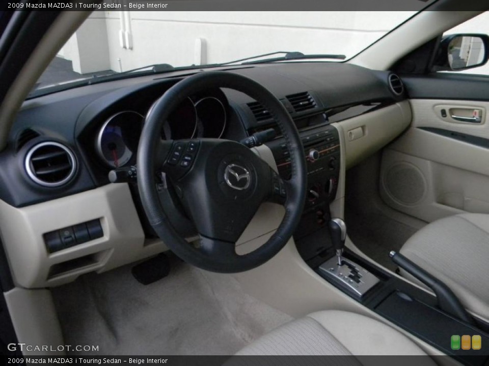 Beige Interior Dashboard for the 2009 Mazda MAZDA3 i Touring Sedan #39100110