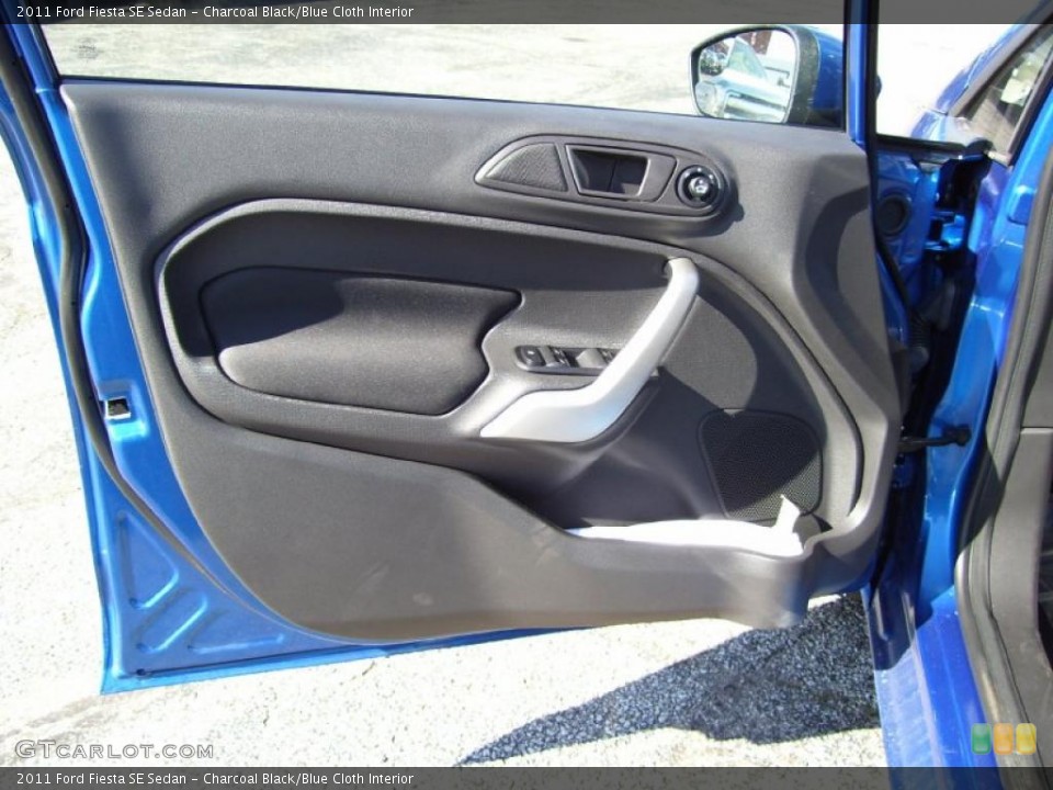 Charcoal Black/Blue Cloth Interior Door Panel for the 2011 Ford Fiesta SE Sedan #39127335