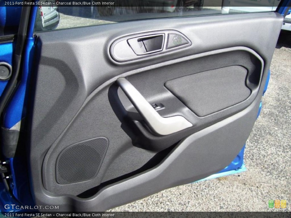 Charcoal Black/Blue Cloth Interior Door Panel for the 2011 Ford Fiesta SE Sedan #39127679