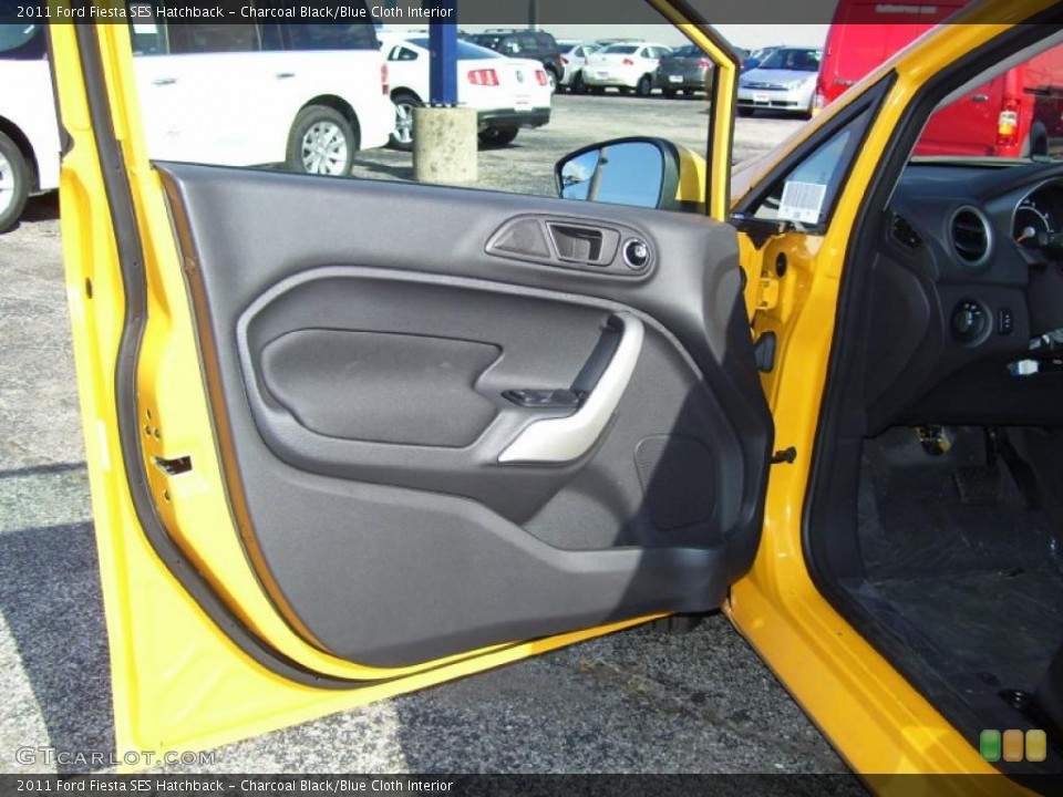 Charcoal Black/Blue Cloth Interior Door Panel for the 2011 Ford Fiesta SES Hatchback #39127923