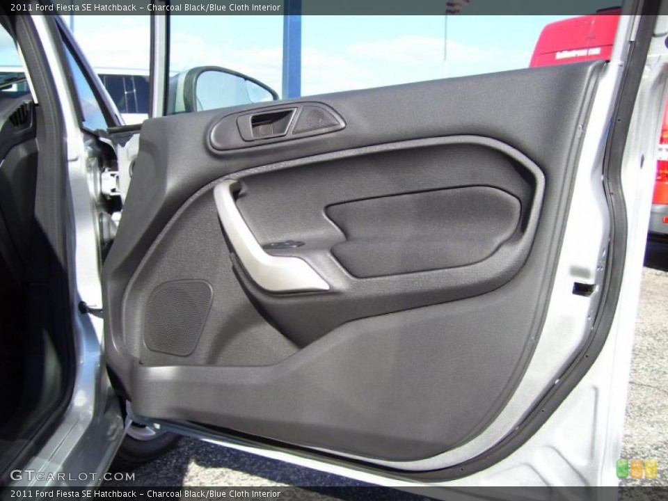 Charcoal Black/Blue Cloth Interior Door Panel for the 2011 Ford Fiesta SE Hatchback #39128511