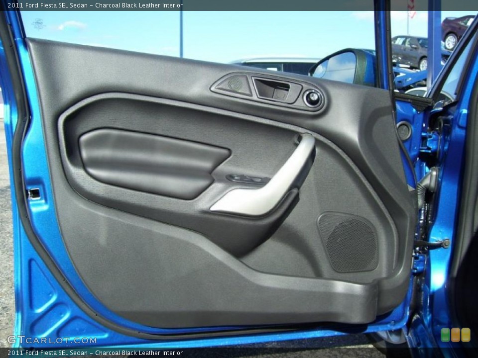 Charcoal Black Leather Interior Door Panel for the 2011 Ford Fiesta SEL Sedan #39129115