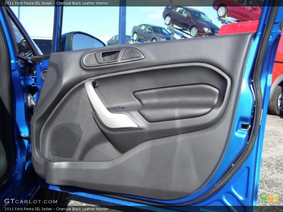 Charcoal Black Leather Interior Door Panel for the 2011 Ford Fiesta SEL Sedan #39129127