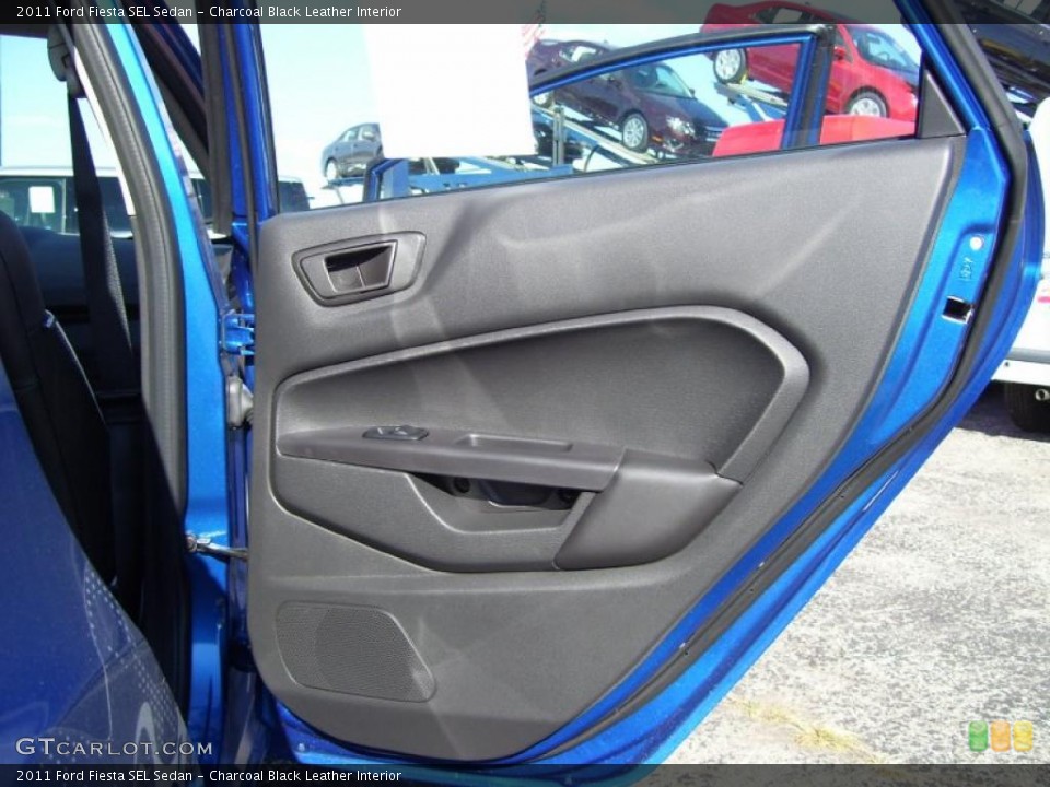 Charcoal Black Leather Interior Door Panel for the 2011 Ford Fiesta SEL Sedan #39129139