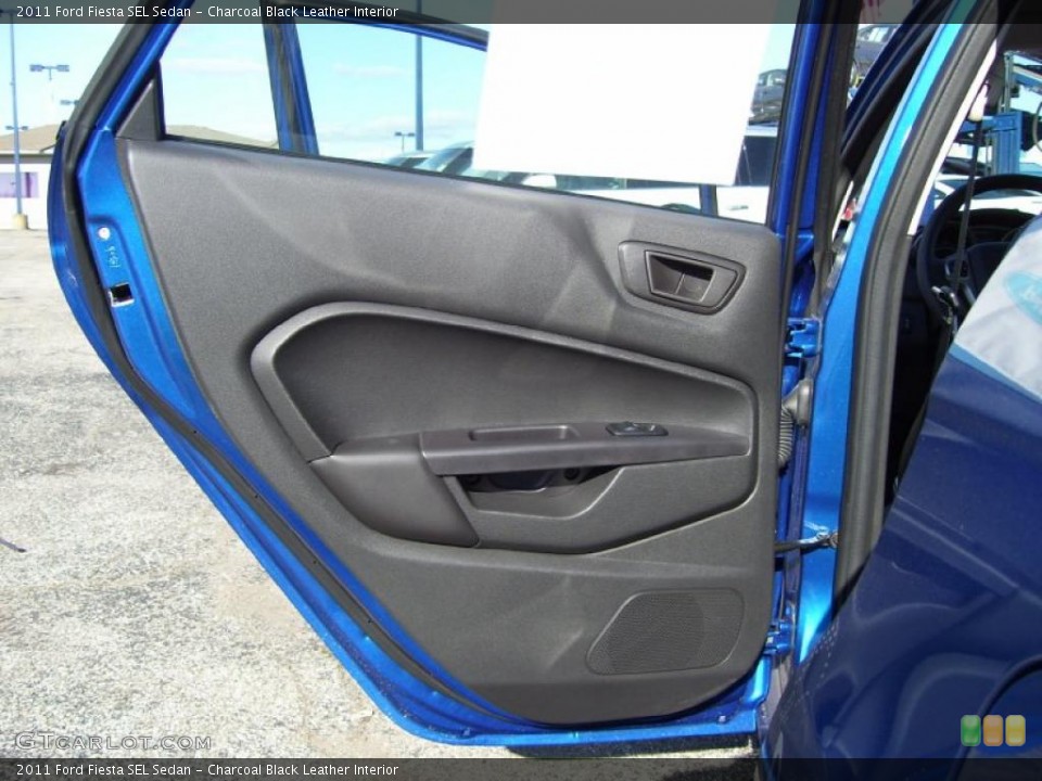 Charcoal Black Leather Interior Door Panel for the 2011 Ford Fiesta SEL Sedan #39129151
