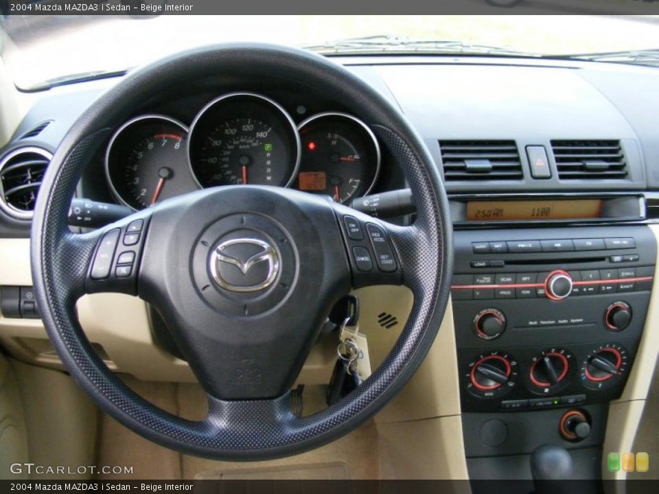 Beige Interior Dashboard for the 2004 Mazda MAZDA3 i Sedan #39137806