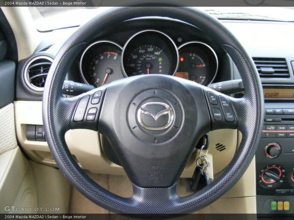 Beige Interior Steering Wheel for the 2004 Mazda MAZDA3 i Sedan #39137822