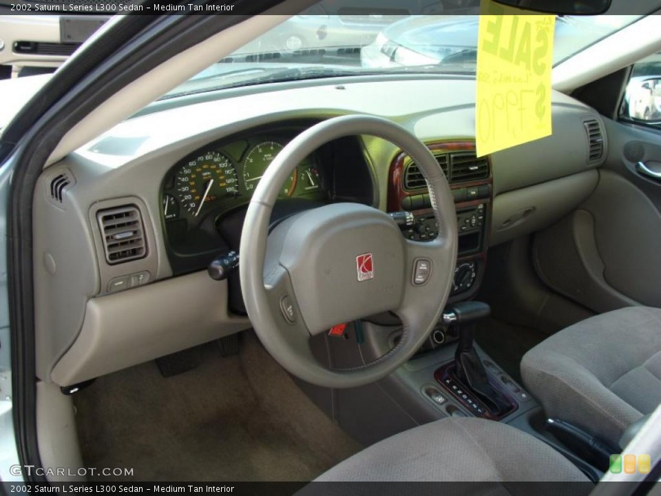 Medium Tan Interior Prime Interior for the 2002 Saturn L Series L300 Sedan #39153545
