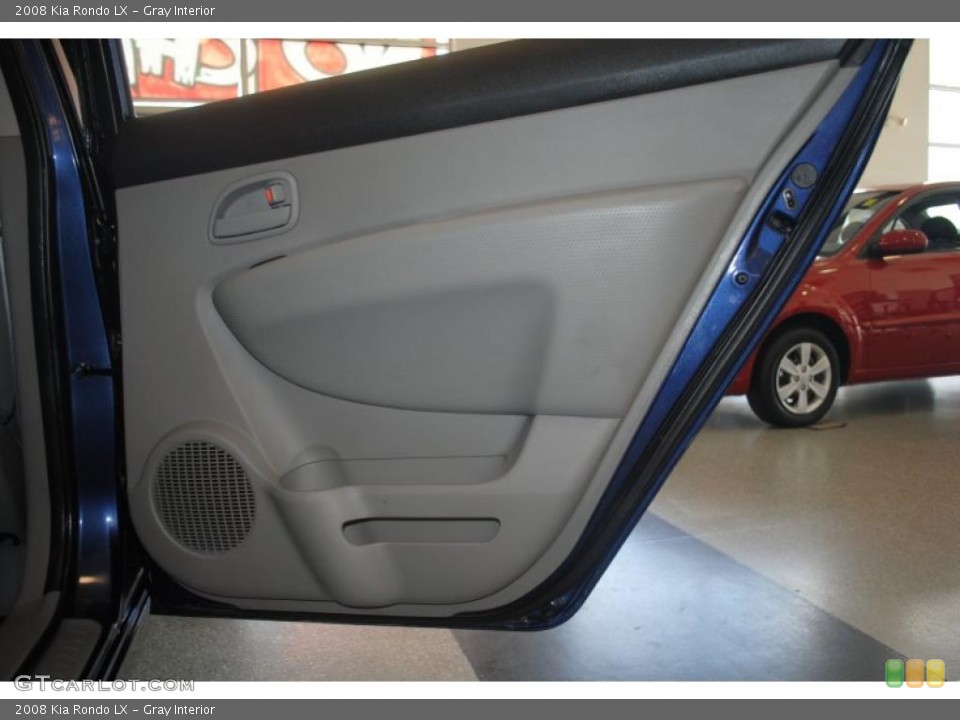 Gray Interior Door Panel for the 2008 Kia Rondo LX #39202843