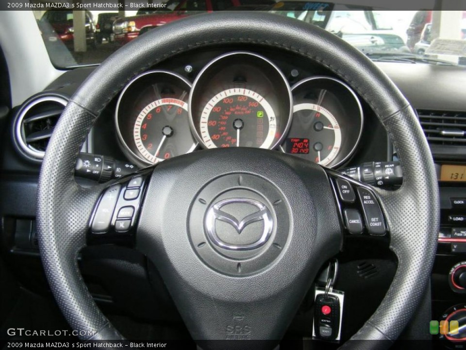 Black Interior Steering Wheel for the 2009 Mazda MAZDA3 s Sport Hatchback #39282251