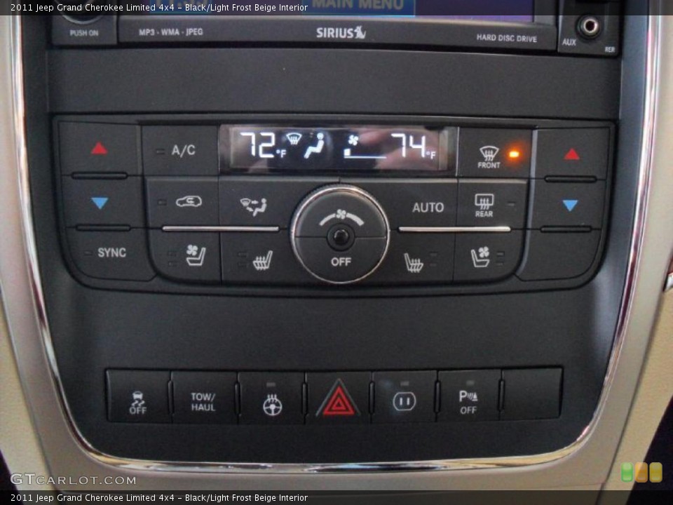Black/Light Frost Beige Interior Controls for the 2011 Jeep Grand Cherokee Limited 4x4 #39360336