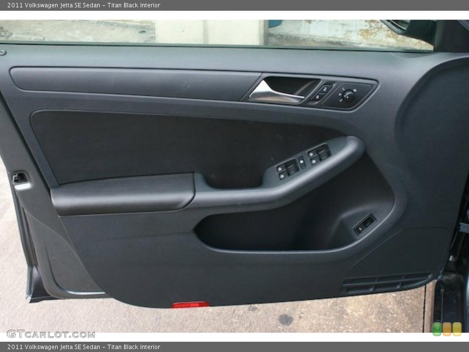 Titan Black Interior Door Panel for the 2011 Volkswagen Jetta SE Sedan #39386653