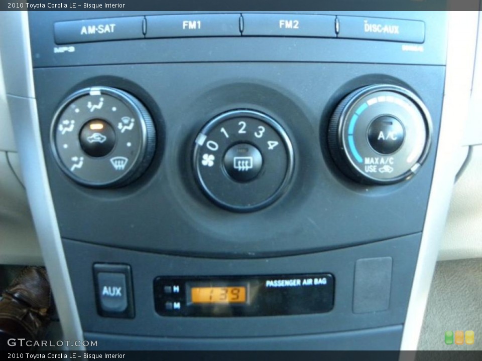 Bisque Interior Controls for the 2010 Toyota Corolla LE #39402042