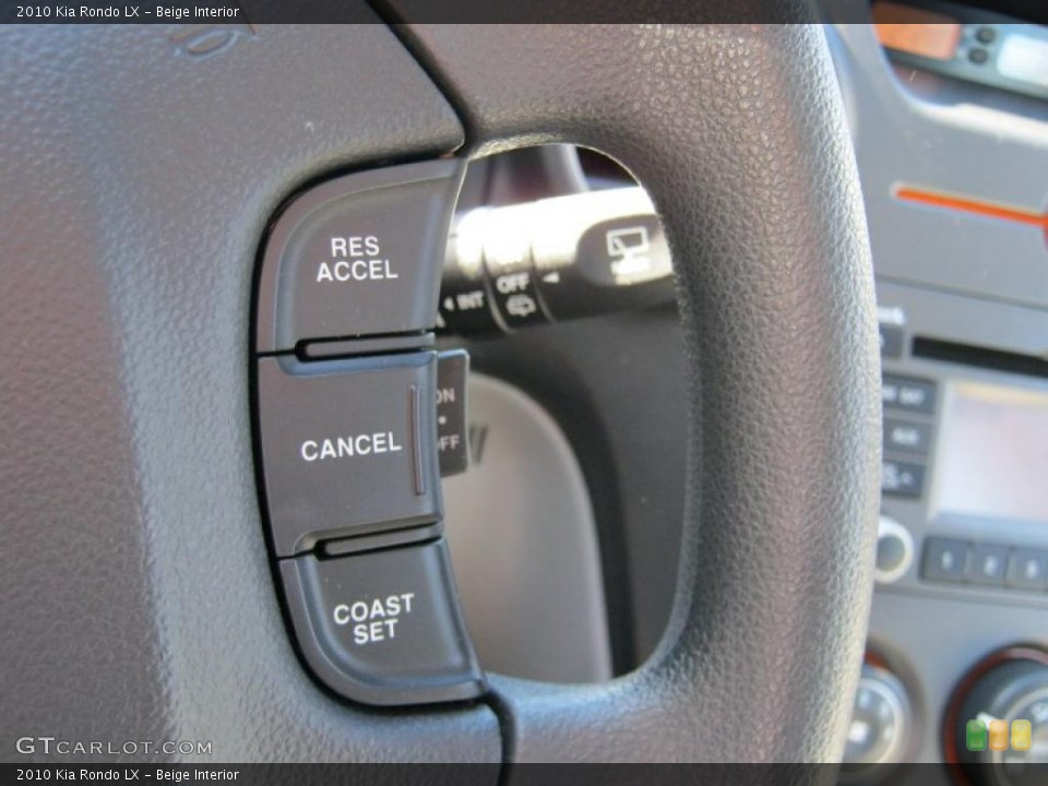 Beige Interior Controls for the 2010 Kia Rondo LX #39413905