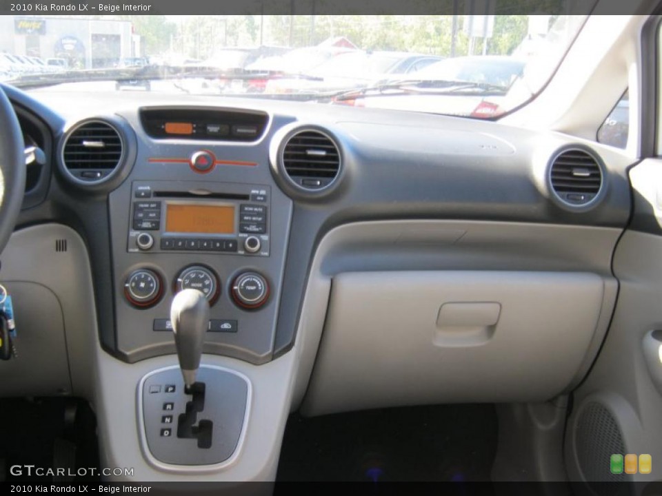Beige Interior Dashboard for the 2010 Kia Rondo LX #39414133