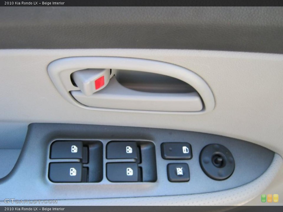 Beige Interior Controls for the 2010 Kia Rondo LX #39414181