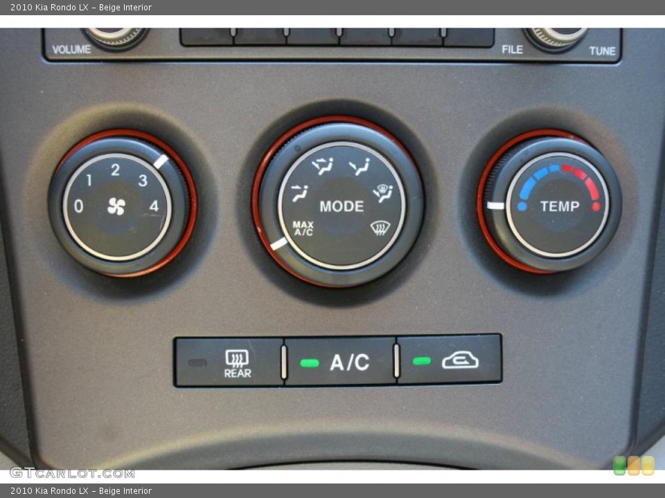 Beige Interior Controls for the 2010 Kia Rondo LX #39414801