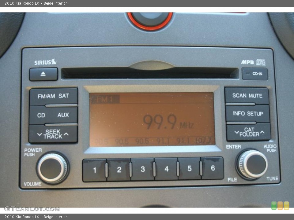 Beige Interior Controls for the 2010 Kia Rondo LX #39414813