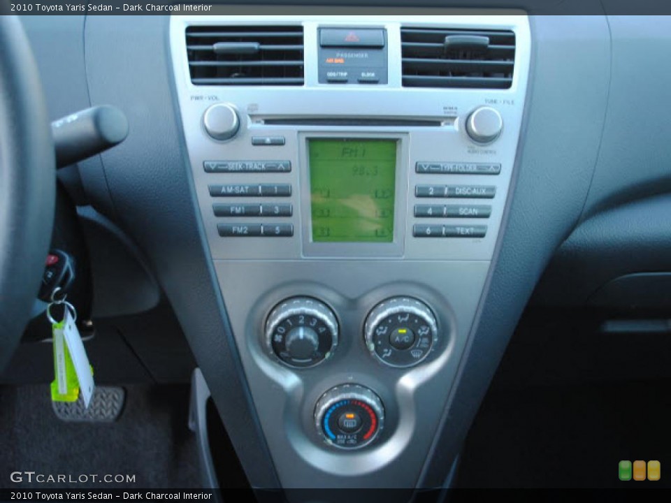 Dark Charcoal Interior Controls for the 2010 Toyota Yaris Sedan #39419193