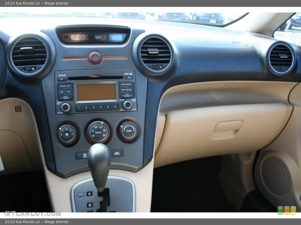 Beige Interior Dashboard for the 2010 Kia Rondo LX #39419689