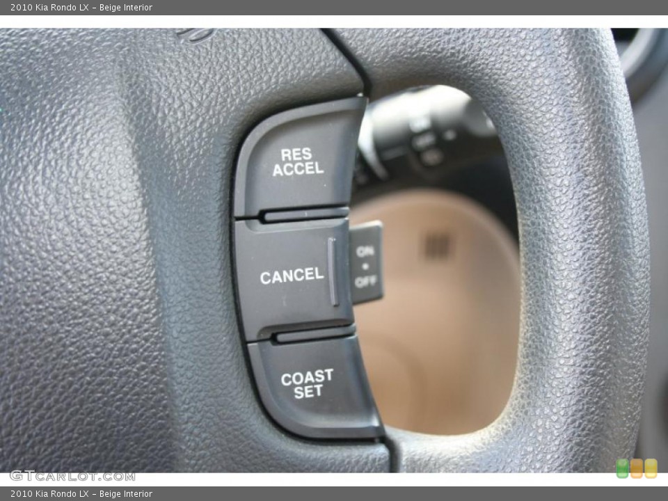 Beige Interior Controls for the 2010 Kia Rondo LX #39419705