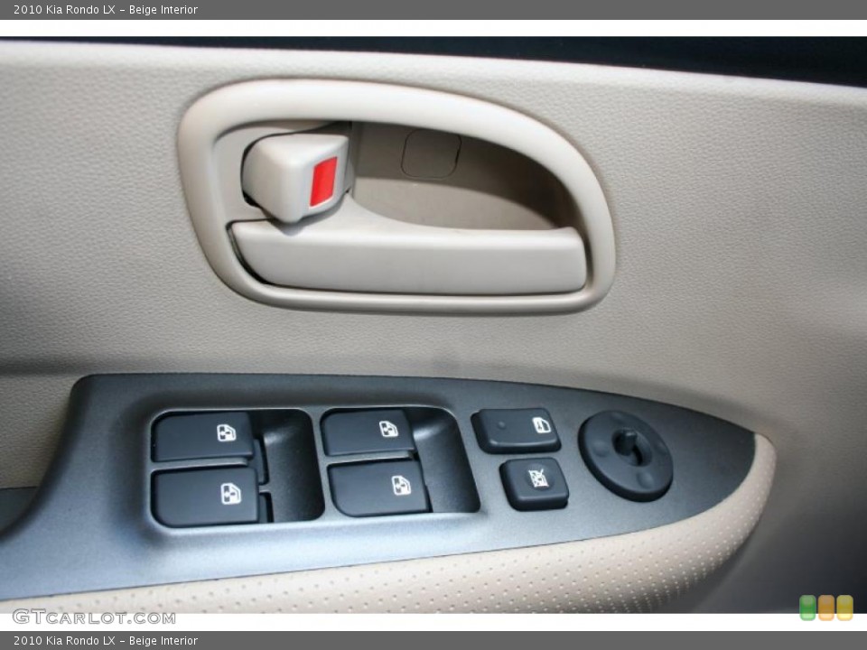 Beige Interior Controls for the 2010 Kia Rondo LX #39419721