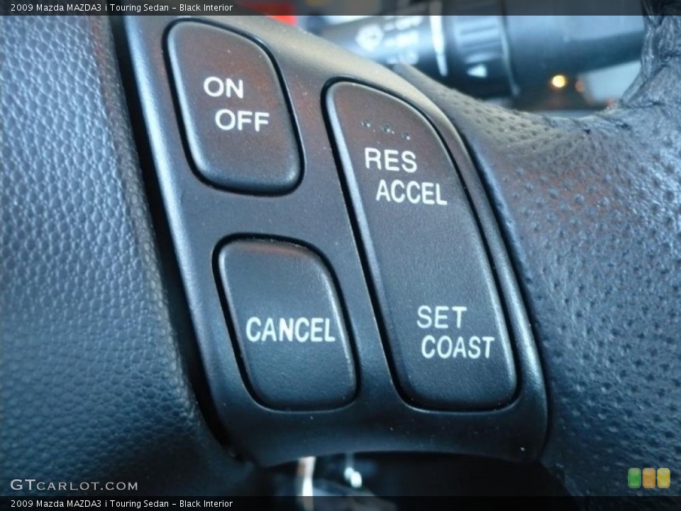 Black Interior Controls for the 2009 Mazda MAZDA3 i Touring Sedan #39429618