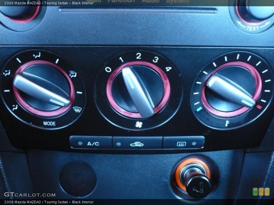 Black Interior Controls for the 2009 Mazda MAZDA3 i Touring Sedan #39429642